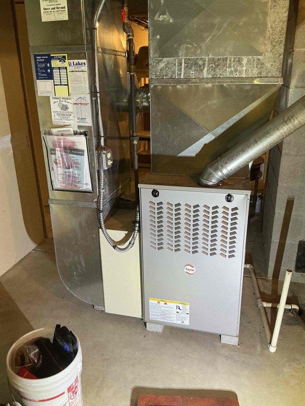 Performed scheduled contract maintenance on a Payne gas-fired furnace serving the commercial space, including visual inspection of the cabinet, plenum, ductwork, flue venting, gas piping, and electrical connections. Verified heating operation by measuring supply-air temperature at the plenum with a digital thermometer, recording 126.3°F, within normal range for gas heat. No frost, ice, rust, or component damage was observed, and the unit was left operating normally.