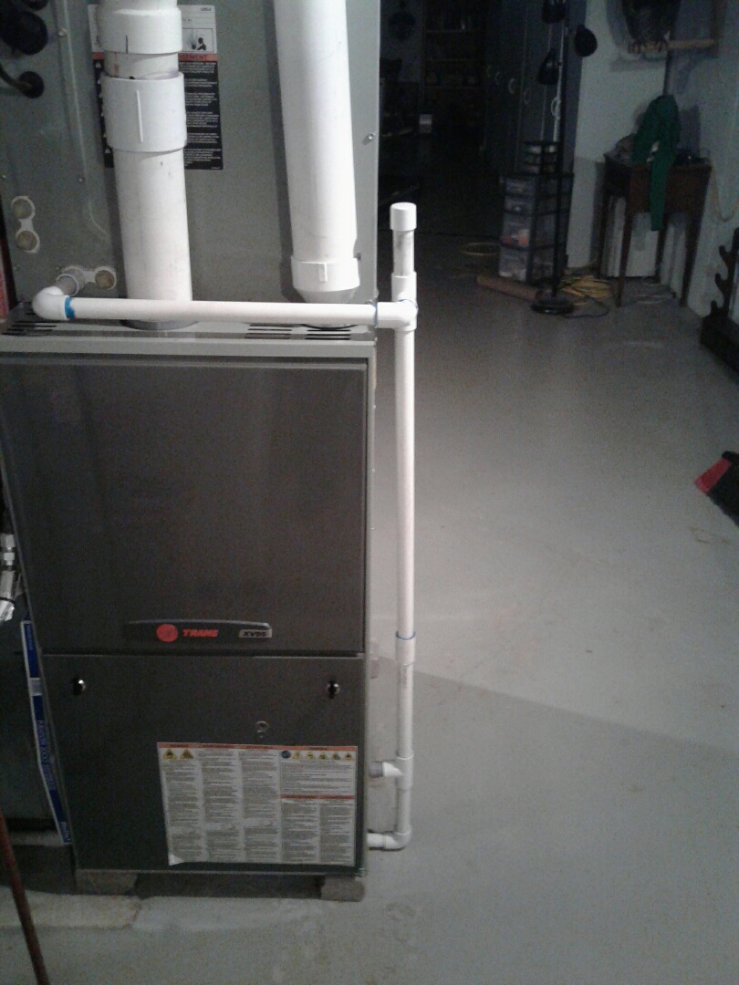 Perform maintenance on Trane furnace 