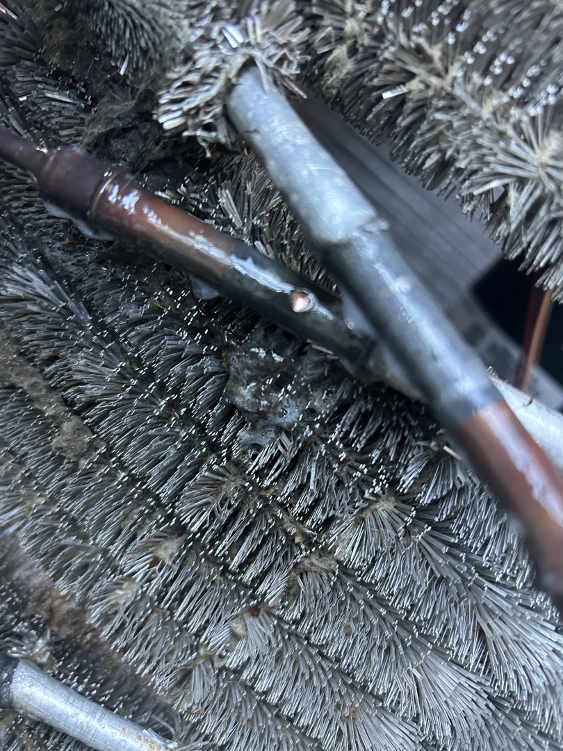 I was greeted by Olivia on arrival. She stated the same unit that we have been out on multiple times wasn’t working. I put in a call for cooling and the outdoor unit wouldn’t come on. I added my gauges and found it completely empty of refrigerant. I added some nitrogen and found a line had rubbed through on the condenser coil. The unit is under part warranty. I sent a warranty estimate to John. The disconnect is out at this time. John was not on site. I discussed the findings with Olivia.