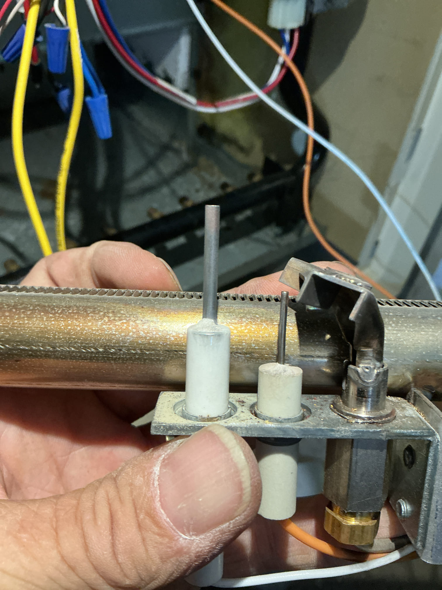 Upon arrival, I was shown to the boiler. The customer turned the thermostat up. 
The boiler came on. I shut off the power.
I pulled and cleaned the burners and the heat exchanger. Cleaned the pilot assembly, flame sensor and spark igniter. Reassembled the parts and restarted the unit. 
I checked gas pressure, water pressure and temperatures. Checked the cycling of the aquastat. Checked the amps on the water pump. 

All functions are normal at this time. 