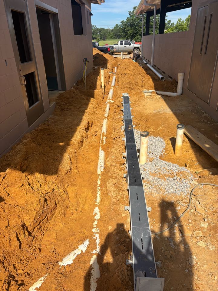 Prattville, AL - Storm water drains. Trench drain and down spout connections to drain box.