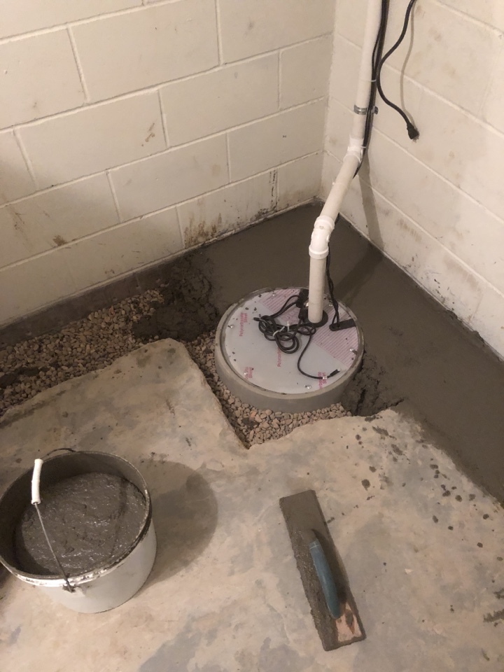 Pouring back concrete floor to seal up drain tile 