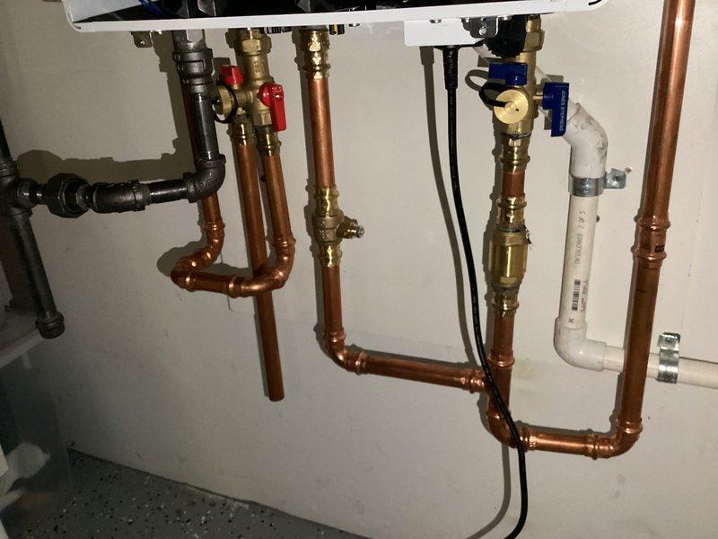 Performed routine maintenance agreement service on customer's heating system, which included inspecting and servicing the furnace, humidifier, and tankless water heater. Checked Ecobee thermostat functionality and verified proper operation of plumbing connections to the tankless unit. All systems functioning within normal parameters.