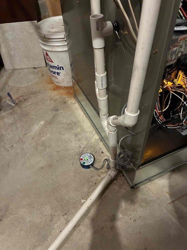Successfully completed installation of a new Carrier furnace system, including integration of a wall-mounted Carrier humidifier and replacement of the existing thermostat. System was properly connected to the existing PVC venting infrastructure with all necessary drainage components installed according to manufacturer specifications.