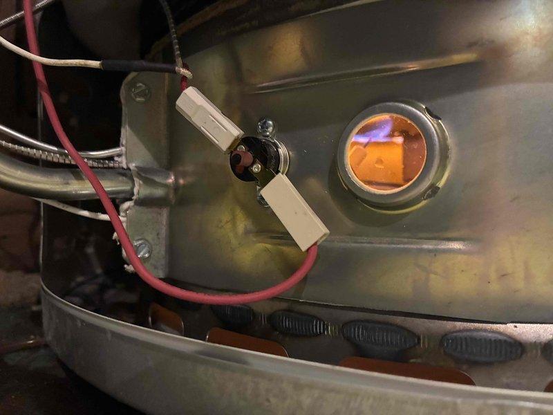 Replaced faulty pilot assembly on customer's water heater. Confirmed proper ignition and flame appearance through sight glass after installation. Unit is now operating correctly with no safety concerns.