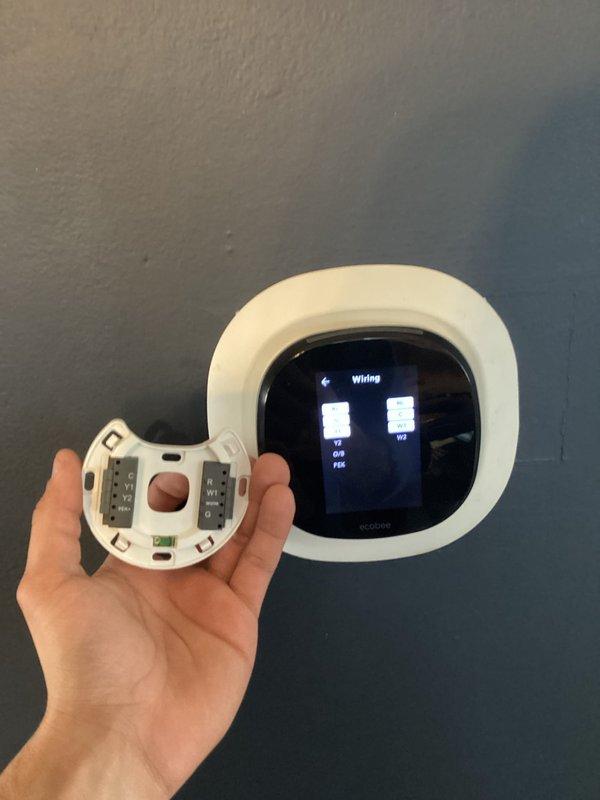Responded to callback for heating system not shutting off. Inspected thermostat wiring connections and control board terminal connections. Identified and corrected improper wire terminations at the smart thermostat that were causing continuous heat call.