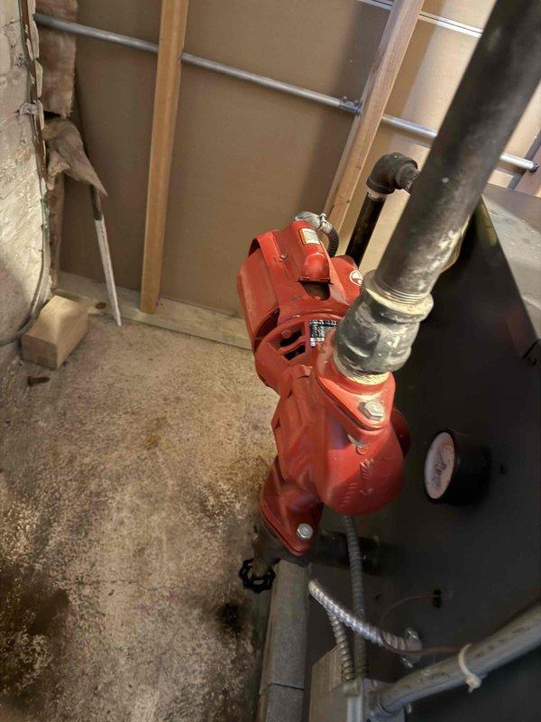 Inspected 30-year-old Weil McLain boiler exhibiting electrical malfunctions in relays and controls, along with air entrapment issues in distribution lines. Documented system condition including worn Enhanced Air Separator (Model EAS, 1-1/4", 150 PSI max) and circulation pump assembly. Recommended complete boiler replacement and installation of additional air vents to address persistent system problems.