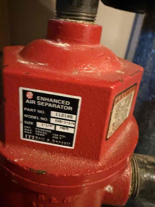 Inspected 30-year-old Weil McLain boiler exhibiting electrical malfunctions in relays and controls, along with air entrapment issues in distribution lines. Documented system condition including worn Enhanced Air Separator (Model EAS, 1-1/4", 150 PSI max) and circulation pump assembly. Recommended complete boiler replacement and installation of additional air vents to address persistent system problems.