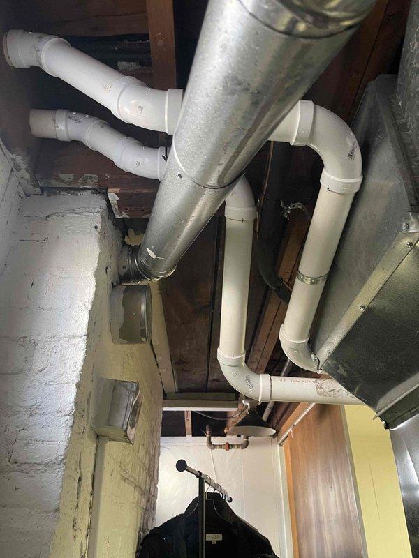 Completed furnace replacement with full PVC venting system installation. New venting system properly routed through utility area with appropriate elbows and connections to ensure proper exhaust. All components tested and verified to be in working order with no leaks detected.