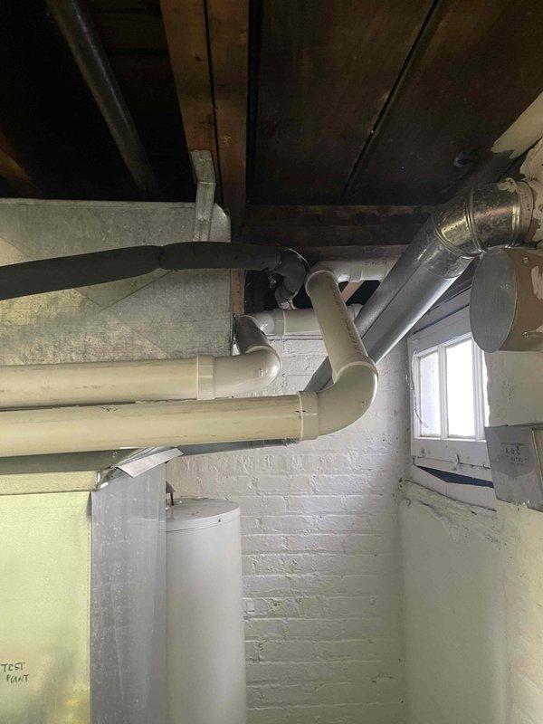 Completed furnace replacement with full PVC venting system installation. New venting system properly routed through utility area with appropriate elbows and connections to ensure proper exhaust. All components tested and verified to be in working order with no leaks detected.