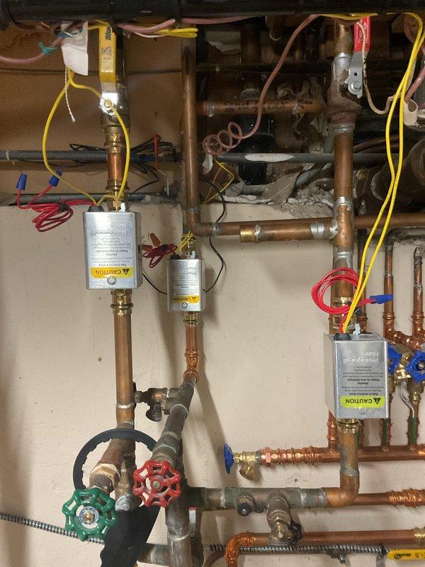 Responded to service call for non-operational boiler. Performed diagnostic inspection on Navien unit with integrated water treatment system. Resolved issue through cleaning and adjustment of copper pipe connections, ensuring proper flow through filtration components and verifying functionality of control valves.