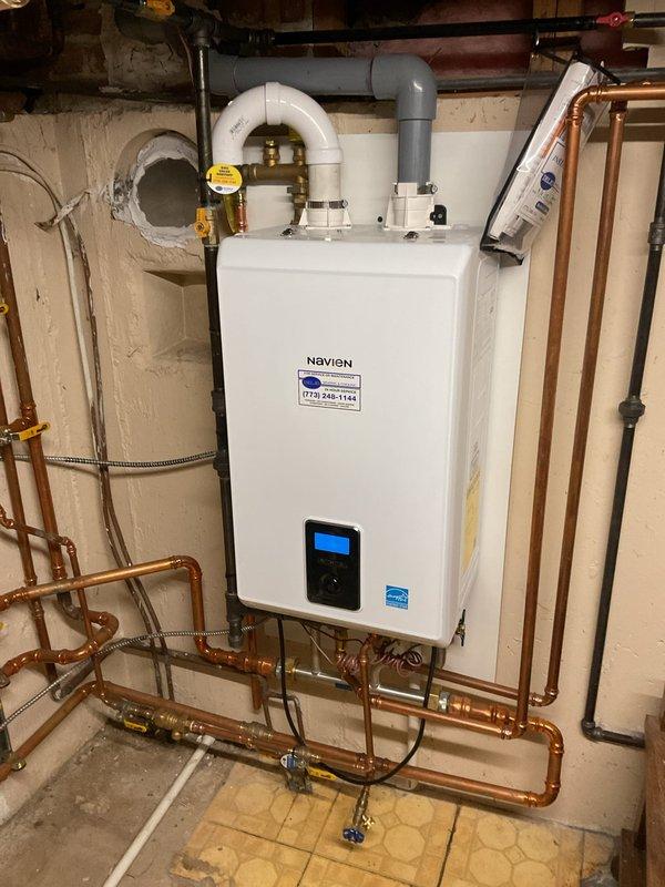 Responded to service call for non-operational boiler. Performed diagnostic inspection on Navien unit with integrated water treatment system. Resolved issue through cleaning and adjustment of copper pipe connections, ensuring proper flow through filtration components and verifying functionality of control valves.