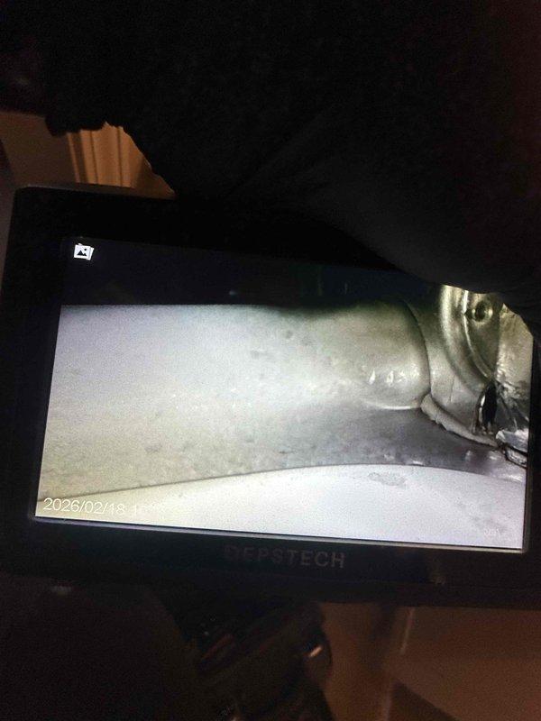 Performed diagnostic evaluation on aging furnace system (10+ years) in response to no-heat complaint. Inspected thermostat functionality, which displayed proper temperature reading (69°) and operating status. Conducted detailed inspection of heat exchanger and connection points using camera equipment, revealing significant deterioration that impacts system safety and efficiency. Recommended replacement options based on equipment age and condition findings.