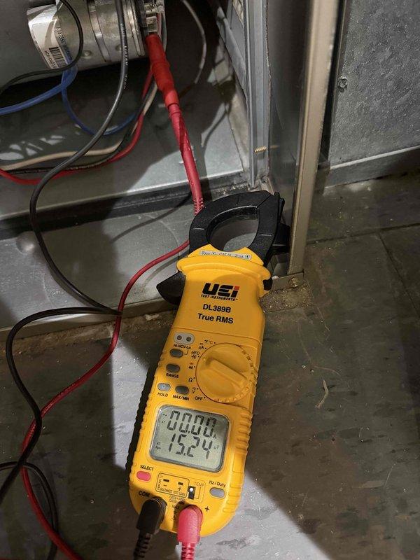 Diagnosed Carrier furnace issue causing cold air output and short cycling. Performed electrical testing with multimeter showing 15.24 amp draw. Identified and replaced two damaged air filters that were bending due to excessive pressure differential, which was restricting airflow and causing system inefficiency.