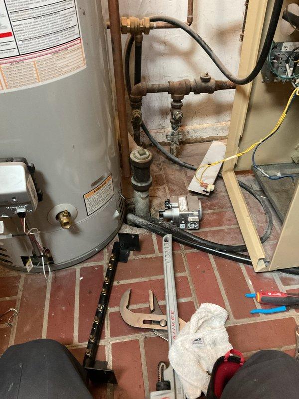Returned to residence to replace faulty gas valve in boiler system as scheduled. Disconnected existing gas line, removed deteriorated valve assembly from heat exchanger, and installed new OEM gas valve. Performed operational test after installation, confirming proper ignition sequence and normal flame pattern across copper heat exchanger tubes.