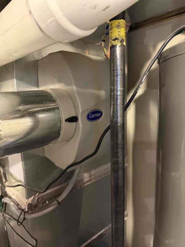 Conducted assessment of 10-11 year old HVAC system (Carrier brand) showing significant internal rust formation and motor degradation. Evaluation revealed aging equipment with compromised components despite the unit having easy access. Recommendation provided for full system replacement due to age-related deterioration and potential reliability concerns.