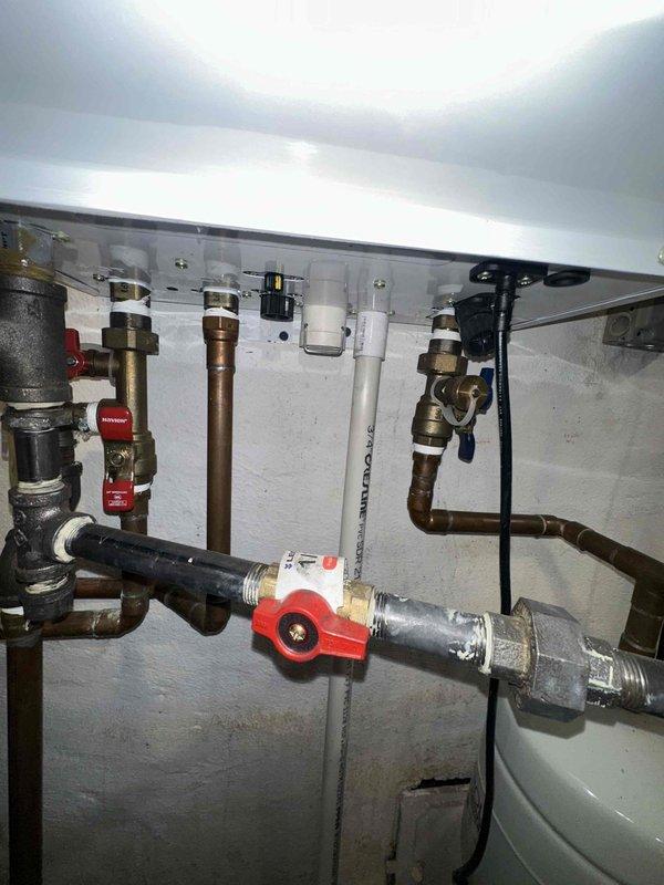 Performed scheduled maintenance on CC 1 Boiler system, humidifier, and tankless water heater per agreement. Inspected all plumbing connections including copper pipes, PVC components, and control valves for proper operation. Verified functionality of control panel with indicator lights and checked integrity of insulated piping and electrical connections.