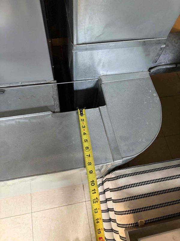 Performed comprehensive evaluation of 2012 furnace exhibiting inducer motor failure. Inspected ductwork connections and measured clearances, noting significant metal deterioration and possible corrosion at junction points. Recommended full system replacement due to age of existing equipment (2001 AC unit) and safety concerns with current installation.
