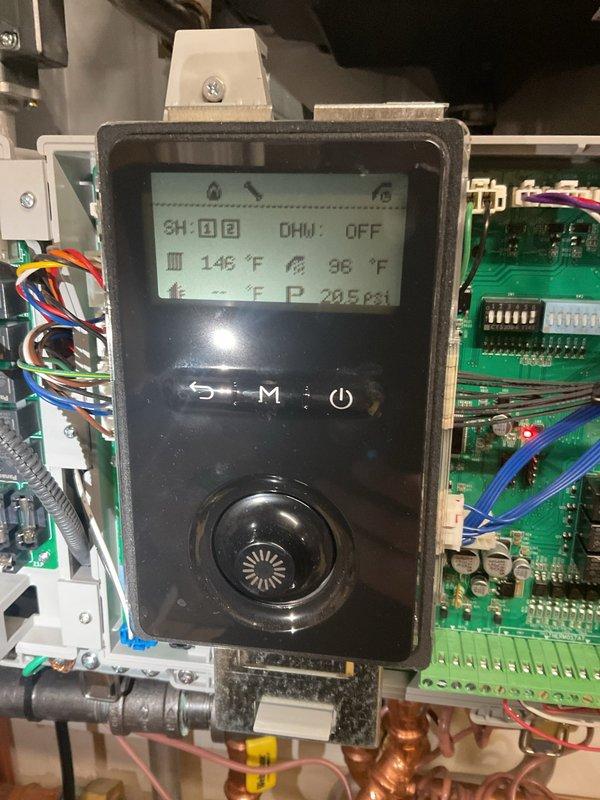 Successfully replaced defective zone valve head for 2nd floor heating zone under warranty. Verified proper operation of control board and system functionality, with temperature readings of 146°F supply and 96°F return at 205psi. System is now operating within normal parameters.