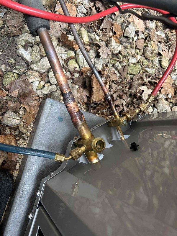 Successfully completed a full HVAC system replacement, installing a new Carrier condenser unit on the existing concrete pad. Replaced deteriorated copper refrigerant lines that showed significant corrosion and oxidation, and installed new brass service valves to ensure proper system operation and maintenance access.