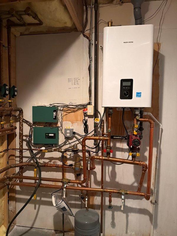 Successfully replaced two zone valve bodies in the multi-zone hydronic heating system, which required draining and refilling the system. Verified proper operation of all ten zone valves and confirmed the Navien boiler was functioning correctly after service completion.