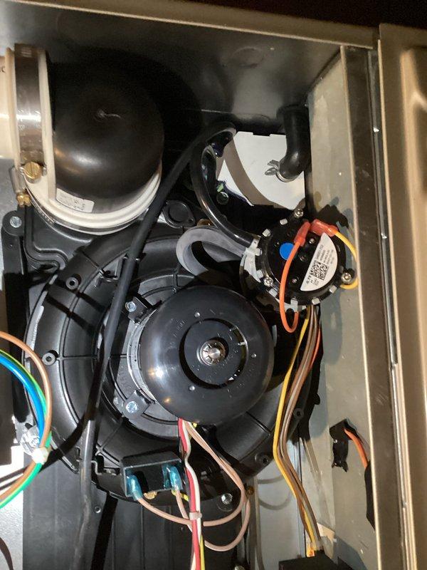 Returned to residence to replace defective condensate trap and inducer assembly under full warranty coverage. Removed original components and installed new OEM parts, ensuring proper electrical connections and secure mounting of all assemblies. System tested after installation with normal operation confirmed.