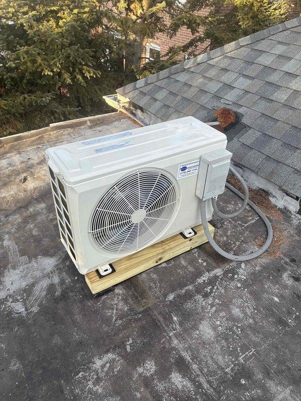 Completed replacement of a 1-to-1 mini-split system, including removal of the damaged indoor unit requiring wall access and installation of a new outdoor condenser unit on the existing roof-mounted wooden platform. Connected refrigerant lines and ensured proper system operation after installation.