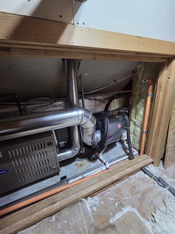 Successfully installed new Carrier furnace unit with integrated humidifier in utility area. Completed all necessary ductwork connections, including proper installation of metal piping and copper line connections. System was tested and is functioning according to manufacturer specifications.