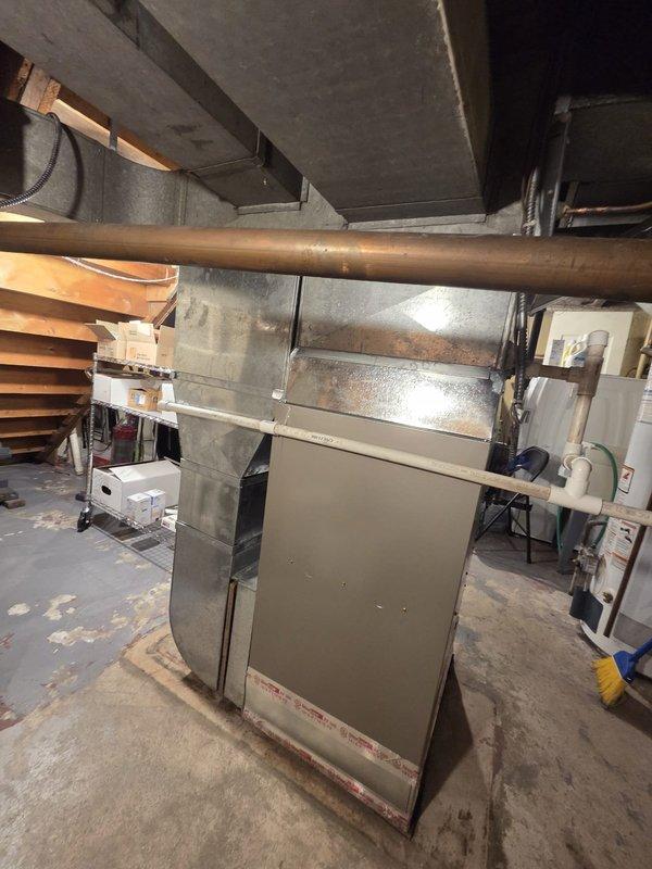 Removed and disposed of existing aged furnace unit from basement utility room. Installed new replacement furnace, ensuring proper connection to existing galvanized metal ductwork system. Verified all connections were secure and system was functioning correctly before completing the installation.