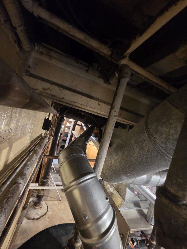 Removed and disposed of existing aged furnace unit from basement utility room. Installed new replacement furnace, ensuring proper connection to existing galvanized metal ductwork system. Verified all connections were secure and system was functioning correctly before completing the installation.