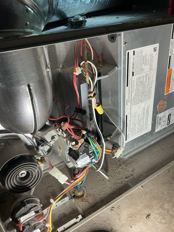 Performed routine maintenance on HVAC system per Agreement terms. Inspected Honeywell thermostat (set at 79°F with heat active) and examined furnace interior components including wiring connections, control board, and blower assembly. All systems operating within normal parameters.