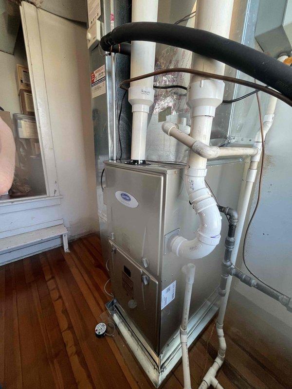 Completed installation of a new Carrier furnace with integrated thermostat and humidifier according to specified scope of work. Performed comprehensive system testing including differential pressure measurements with manometer, confirming proper operation at 1.50" WC. Installation included complete PVC venting system with appropriate condensate drainage to ensure optimal system performance and efficiency.
