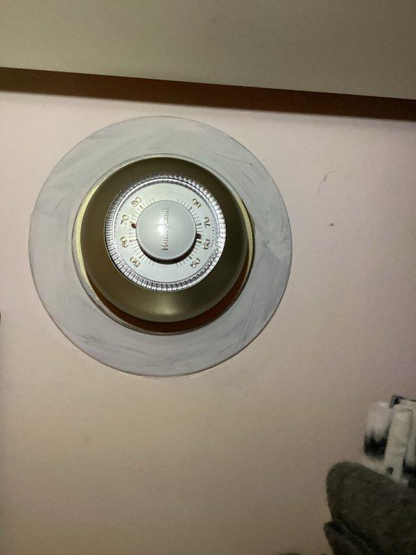 Responded to service call for non-functioning boiler. Inspected aging light blue boiler unit mounted on concrete platform with extensive black piping system. Determined unit has reached end of useful life and requires replacement; customer advised of findings.