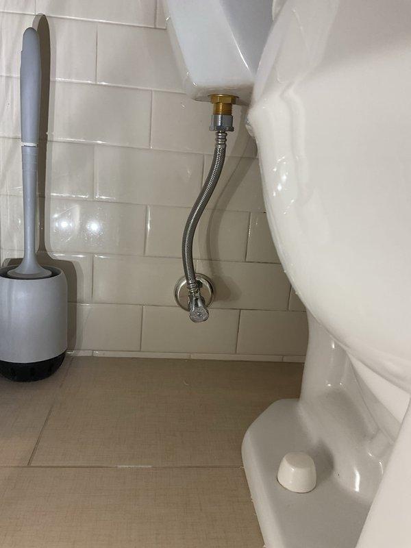 Completed tank rebuild service with installation of new toilet fixture, including proper connection of supply line and shut-off valve. Replaced three p-traps to ensure proper drainage. Waterproofing work was performed around shower pan area with temporary protection materials in place during installation.