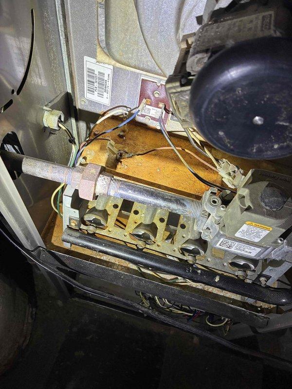Responded to no-heat call for aging furnace (10+ years old). Inspection revealed significant dust accumulation on blower wheel affecting airflow and operation. Cleaned and serviced blower assembly, inspected burner components showing rust and wear, and restored system functionality. Unit operational upon departure.