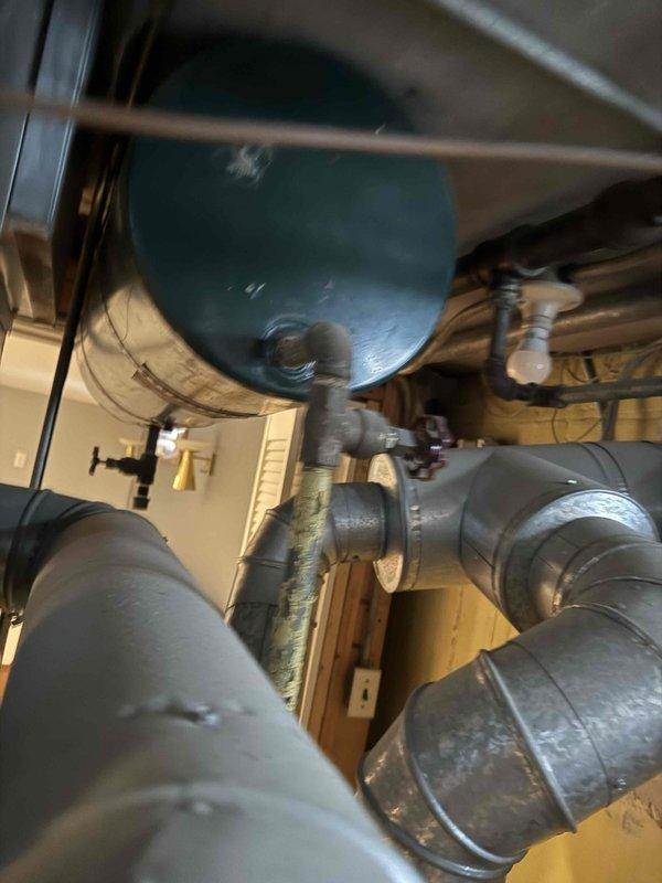 Conducted site assessment for boiler replacement in basement and furnace replacement on first floor of 1,200 sq ft home. Documented existing equipment including cylindrical water heating system with insulated piping connections and existing HVAC unit with connected ductwork and PVC drainage. Customer requested comprehensive quote including equipment and installation costs separately, timeline details, warranty information, and optional upgrades such as smart thermostats and variable-speed blowers.