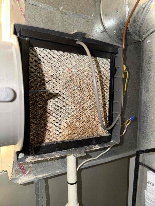 Responded to thermostat malfunction reporting "no power to RH wire" with system not connecting to HVAC and no heat production. Inspection revealed significant dust accumulation in the air filter causing restricted airflow. Replaced dirty filter and restored proper electrical connection to the RH terminal, resulting in full system functionality and heat restoration.
