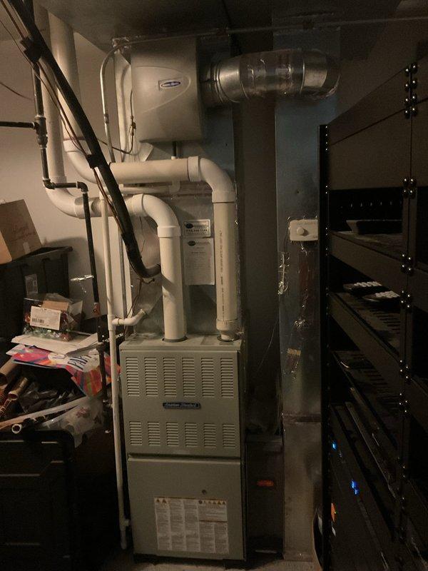 Diagnosed intermittent shutoff issue on American Standard lower level furnace. Found humidity control improperly installed and interfering with normal operation. Adjusted Aprilaire humidity controller settings and verified proper system function with digital temperature readings of 19.2°F.