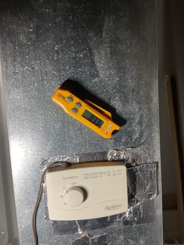 Diagnosed intermittent shutoff issue on American Standard lower level furnace. Found humidity control improperly installed and interfering with normal operation. Adjusted Aprilaire humidity controller settings and verified proper system function with digital temperature readings of 19.2°F.