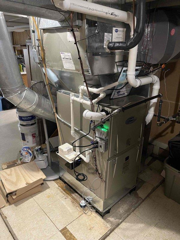 Successfully completed full HVAC system replacement including installation of new furnace unit with PVC venting system, thermostat, humidifier, and condensate pump. System was properly mounted, electrically connected, and tested to ensure optimal performance and compliance with manufacturer specifications.
