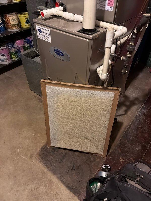 Responded to no-heat call for Carrier furnace system blowing cool air. Conducted system inspection, identified clogged air filter restricting proper airflow. Replaced filter, cleaned components, and verified proper ignition sequence and heat output restoration. System now functioning within manufacturer specifications.