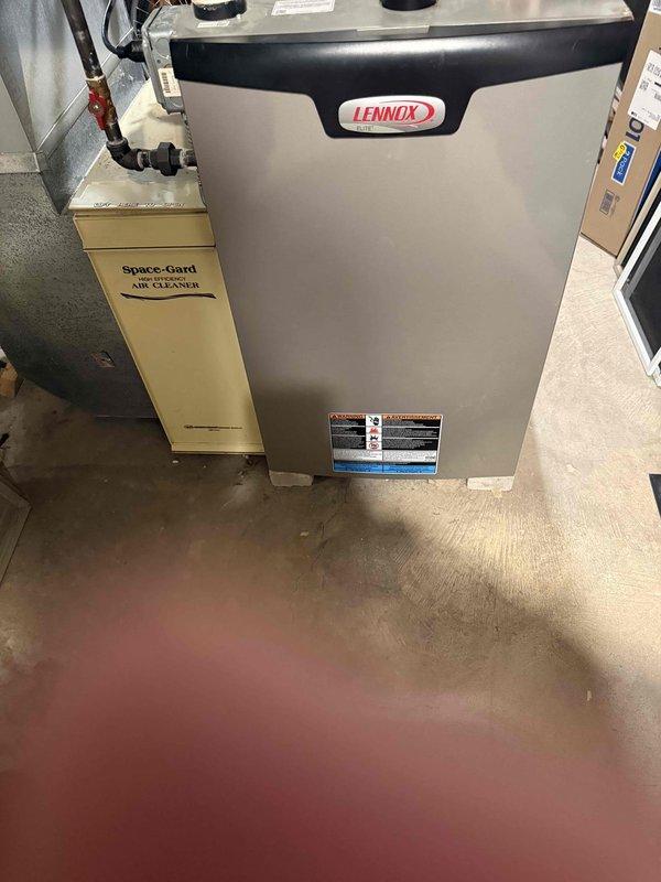 Inspected 11-year-old Lennox furnace and identified multiple critical issues including failed collector box and pressure switches. Determined the condensate trap requires replacement as it was permanently glued during original installation, preventing proper maintenance. Took measurements and documented system condition for complete replacement recommendation.