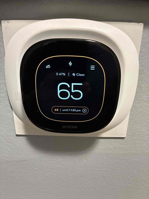 Successfully installed two Ecobee smart thermostats as part of warranty service, with both units confirmed operational and displaying proper temperature readings. Additionally, installed complimentary wet switches at both the upstairs and downstairs furnace units to provide overflow protection.