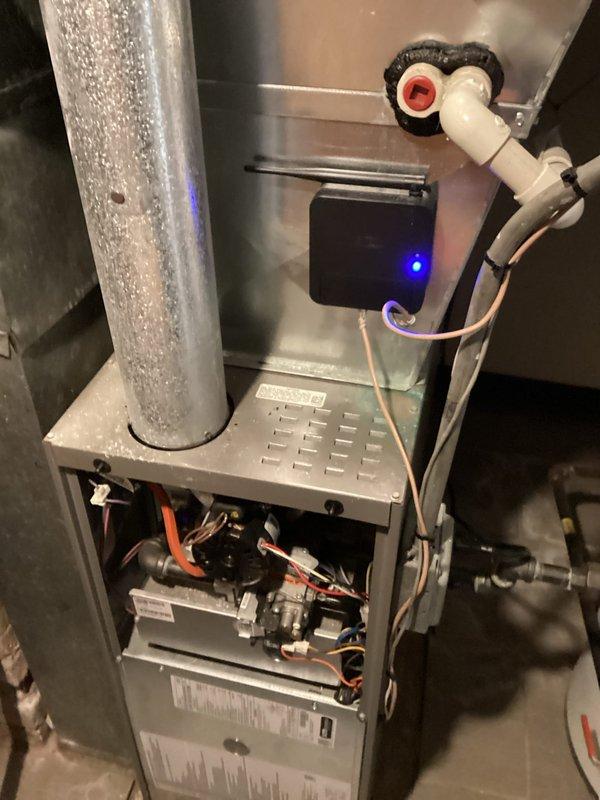 # Service Report: Emergency No Heat Call

Responded to emergency no heat call with interior temperature at 50°F and small children present. Upon arrival, found smart thermostat displaying "Missing Device" error, indicating loss of communication with furnace. Inspected furnace unit and discovered control board communication failure. Removed furnace cabinet to access internal components and diagnosed faulty control module with blue LED indicator. Replaced defective control board and re-established communication between thermostat and furnace. Verified all gas valves, wiring harnesses, and safety controls functioning properly. Tested furnace operation through complete heating cycle, confirmed proper ignition sequence, and restored heat to residence. System returned to normal operation with thermostat communicating successfully with furnace.