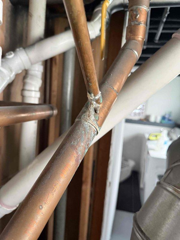 Conducted boiler replacement estimate for 20-year-old existing system. Inspected current boiler installation in basement mechanical room, documenting equipment configuration including existing ductwork, copper piping distribution, and air handling components. Observed frost accumulation on copper supply lines at junction points, indicating potential insulation deficiencies or system operational issues. Evaluated mechanical room layout, existing piping infrastructure including copper supply lines and PVC drainage, electrical service panel access, and overall system integration. Photographed equipment for replacement specifications and provided homeowner with recommendations for new boiler installation.