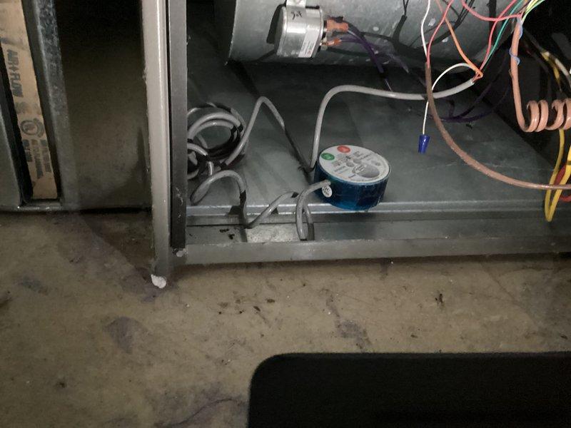 Completed comprehensive cooling and heating maintenance agreement service on gas furnace and air conditioning system. Performed thorough inspection of furnace interior components including blower motor, pressure switch assembly with gauge, gas connections, and electrical wiring. Verified all wire connections secure and tested system electrical parameters using digital multimeter, measuring voltage at 20.00 VAC to ensure proper operation and system safety.