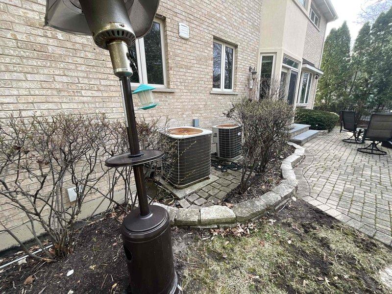 Provided comprehensive estimate for complete replacement of two HVAC systems in residential property built in 2001. Assessed existing dual furnace and air conditioning configuration currently installed in basement mechanical room, along with outdoor condenser units positioned on concrete pads in backyard landscaping area. Customer expressed interest in available spring rebates and federal tax credit opportunities for new high-efficiency equipment installation.