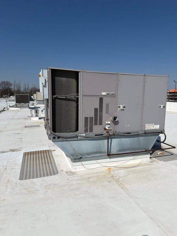 Performed scheduled maintenance agreement service on commercial rooftop HVAC unit. Verified single RTU installation per previous notes regarding unit count discrepancy, inspected blower motor assembly, evaporator coil, refrigerant lines, and electrical connections. All components operational with no deficiencies noted; replaced 18x24x2 filters as specified.