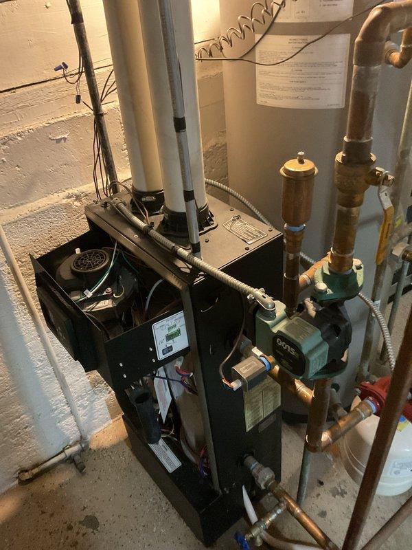 Returned to address ongoing zoning programming issues with the boiler system under warranty. Performed diagnostic evaluation of the zone control interface and programming parameters, documented system configuration with photos of the boiler installation and control display panel for technical support review. Further troubleshooting required to resolve zoning control malfunction.