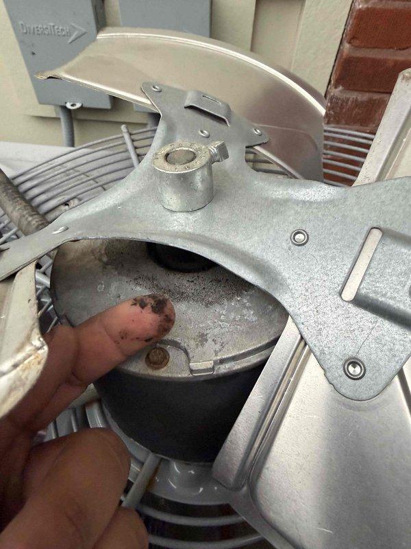 Responded to no cooling complaint on residential air conditioning system. Upon arrival, performed diagnostic testing using multimeter to check electrical components and compressor operation. Measured voltage at compressor terminals, reading 3.18 volts which indicated potential electrical supply issue or failed component. Inspected blower assembly and internal components, noting accumulated dust and debris on surfaces. Conducted thorough examination of motor, capacitor connections, and wiring harness. System blowing warm air due to compressor not engaging properly. Recommended further evaluation of start components and capacitor to restore cooling operation.